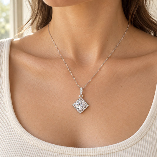 The Princess Halo Moissanite Necklace worn by a model in natural daylight