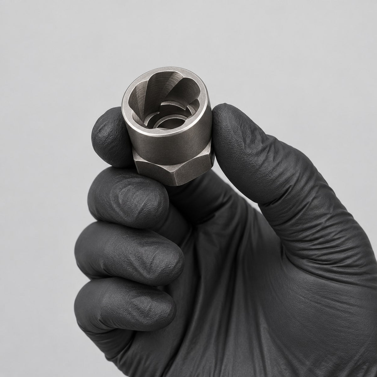 14-piece bolt and nut extractor socket set held in a gloved hand to show its size