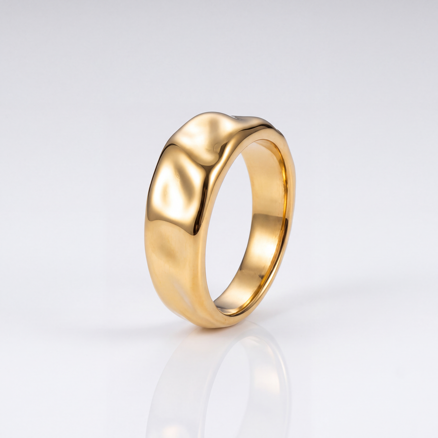 The Ripple Ring by JUSMIR, gold-tone rippled band ring, studio product photo