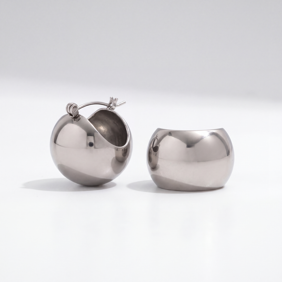 The Sculptural Hoops by JUSMIR, rounded hollow hoop earrings, studio product photo