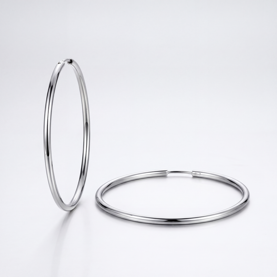 The Everyday Hoops by JUSMIR, slim silver-tone hoop earrings, studio product photo