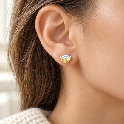 The Tulip Moissanite Studs worn by a model in natural daylight