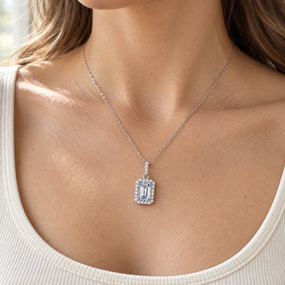 The Emerald Halo Moissanite Necklace worn by a model in natural daylight