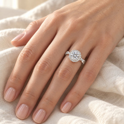 The Halo Moissanite Engagement Ring worn by a model in natural daylight