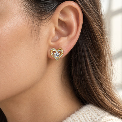 The Heart Moissanite Earrings worn by a model in natural daylight