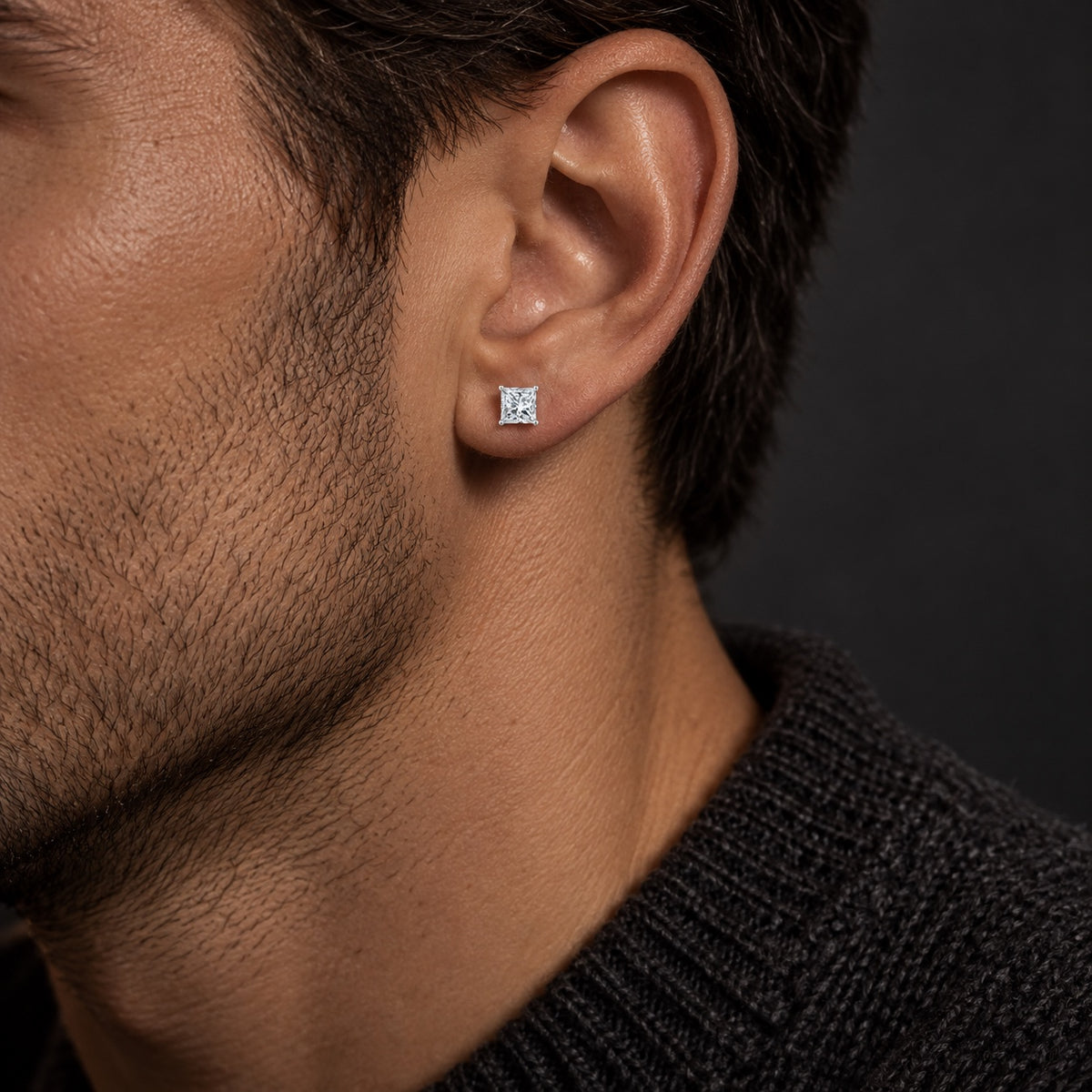 The Princess Cut Moissanite Studs worn by a model