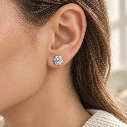 The Flower Moissanite Studs worn by a model in natural daylight, shown in the 7.5 mm size, white gold tone