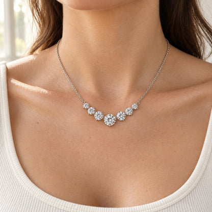 The Graduated Moissanite Necklace worn by a model in natural daylight, shown with the 5 mm centre (1.70 ct total)