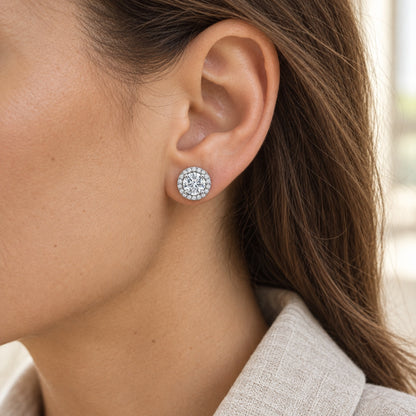 The Halo Moissanite Studs worn by a model in natural daylight, shown with a 6 mm centre stone, white gold plated