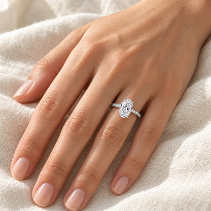 The Oval Moissanite Ring worn by a model in natural daylight, 7 × 9 mm oval centre stone