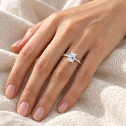 The Radiant Moissanite Ring worn by a model in natural daylight, 5 × 7 mm radiant centre stone