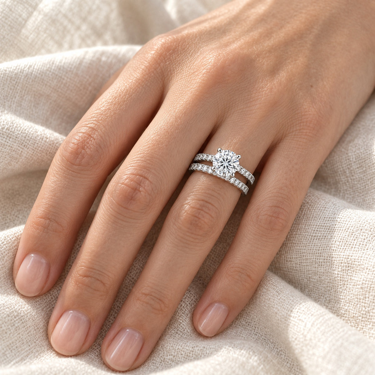 The Moissanite Ring Duo worn by a model in natural daylight, both rings stacked on the ring finger